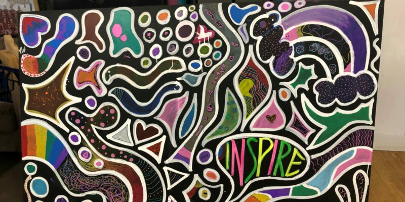 QLD - During Youth Week 2022, around 20-30 young people in the Inala community contributed to a large art mural, with a focus around collaboration and participation. The ages of the children and young people involved were from 4yrs- 25yrs, living in Inala and surrounding suburbs, including Durack, Richlands and Acacia Ridge. When creating the mural, there was discussion around what colours, patterns and designs represent the community, and how to work together to represent what was meaningful for the young people. This rose an exchange of belonging with those who contributed, centred around what designs resonated with the young person’s family, friends, or the neighbourhood, and what colours represented their individual communities and interests, resulting in a collective art piece.