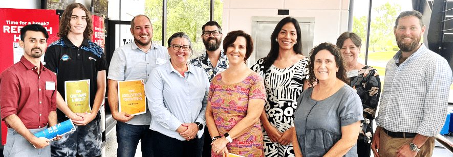 Photograph of Northern Territory Prevention Alliance Group of people in 2024 holding media message guides.